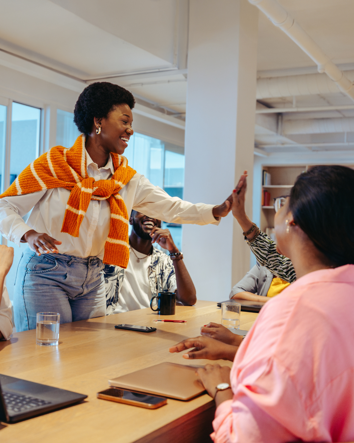 Techrise Africa team celebrating a recovery win around a meeting table