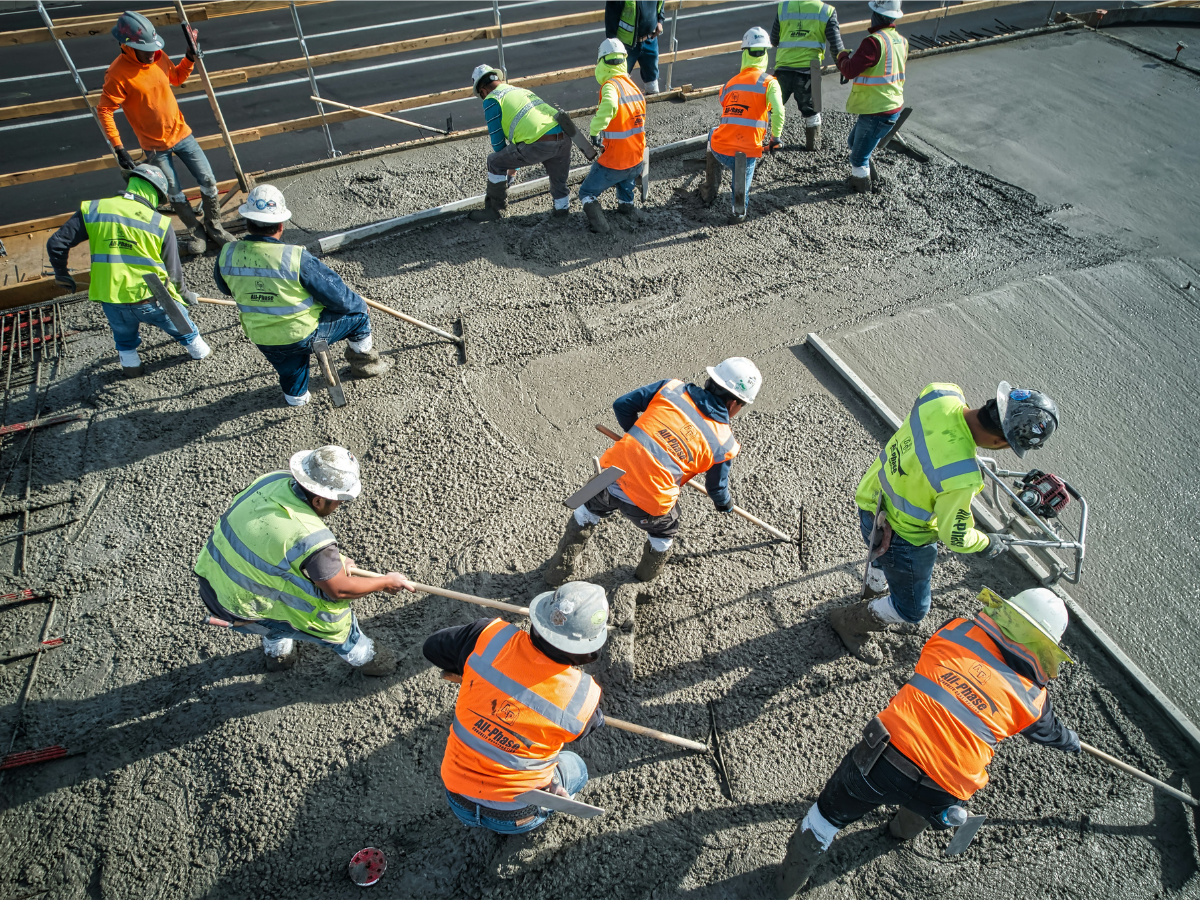 Road crew repairing public infrastructure after damage